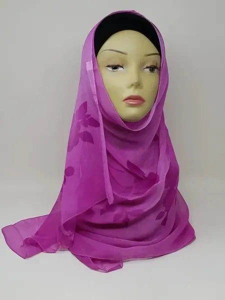 Pink hijab scarf draped on mannequin, lightweight modest headscarf for everyday wear, soft flowy wrap, full coverage hijab style for women, elegant simple design suitable for casual and formal outfits, breathable fabric look, modest fashion accessory, easy to style scarf for daily use, plain pink hijab front and side view