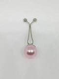 Pink pearl hijab pull pin used to secure hijabs and scarves, elegant modest fashion accessory with decorative pearl bead.