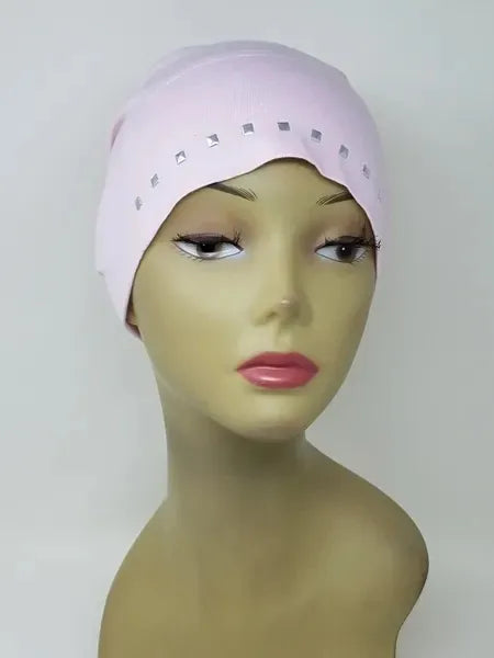 Light pink undercap hijab worn on mannequin, snug stretch cap with small decorative edge details, modest inner hijab cap for secure fit under scarves, soft comfortable fabric for daily wear, side and front view