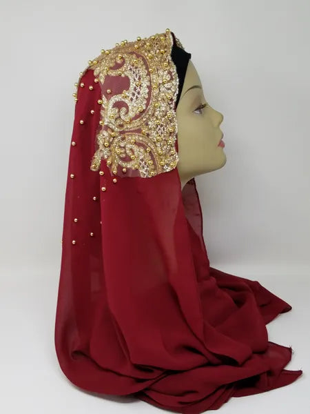 Red headscarf with gold beaded embroidery, elegant Muslim hijab scarf for modest fashion, long red Islamic scarf with decorative beadwork from Affordable Hijab USA.