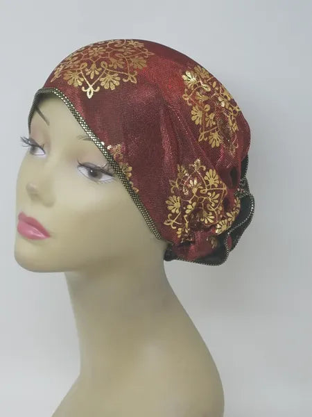 Red gold patterned turban for women with shimmer detail, soft stretch fabric head covering, ready to wear turban headwear, full coverage modest headwear, lightweight breathable turban, slip on hijab alternative, elegant burgundy gold turban for women, comfortable daily wear head covering, stylish patterned turban