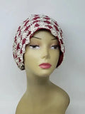 Red and white embellished turban headwrap on mannequin, modest headwear with pearl and bead details, snug comfortable fit, elegant two tone design for special occasions, front and side view