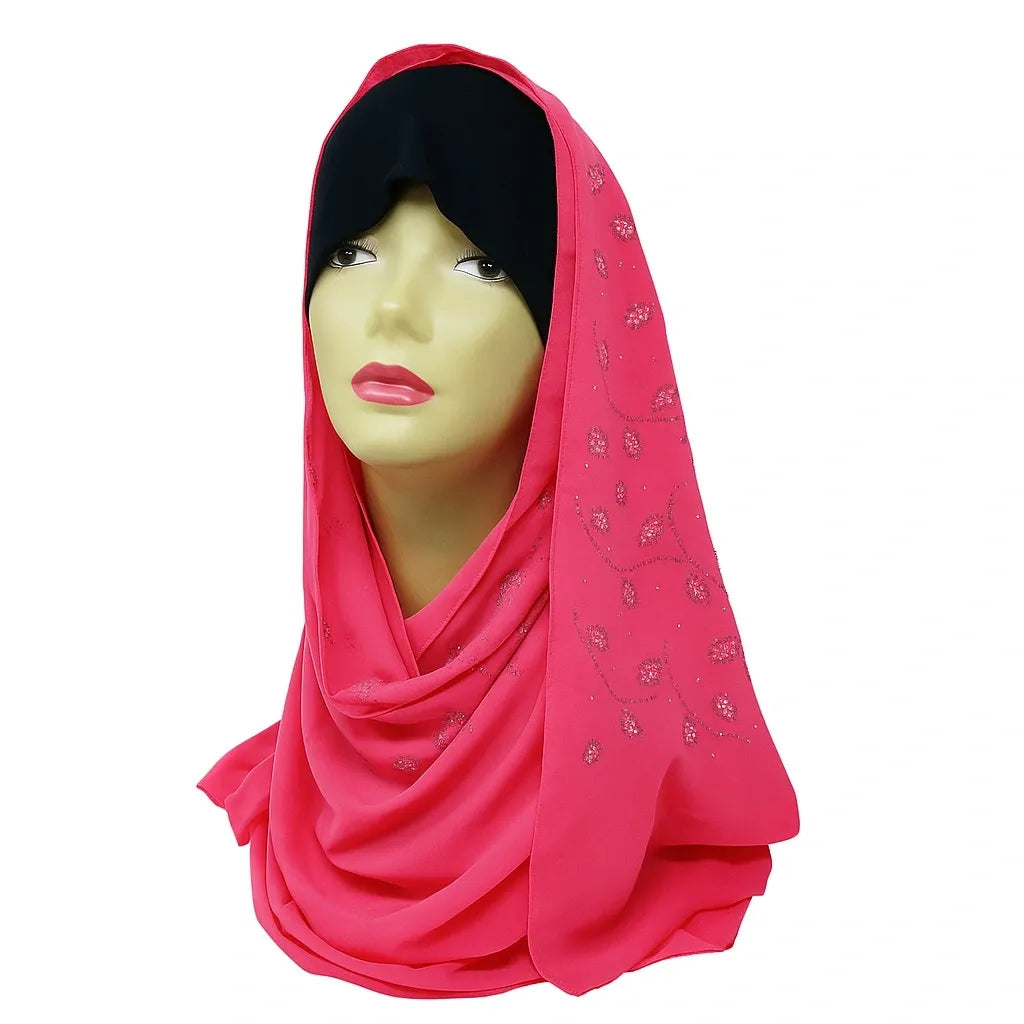 Rose pink chiffon hijab with rhinestone embellishments, elegant modest Muslim headscarf made from lightweight flowing fabric for special occasions and stylish everyday wear.