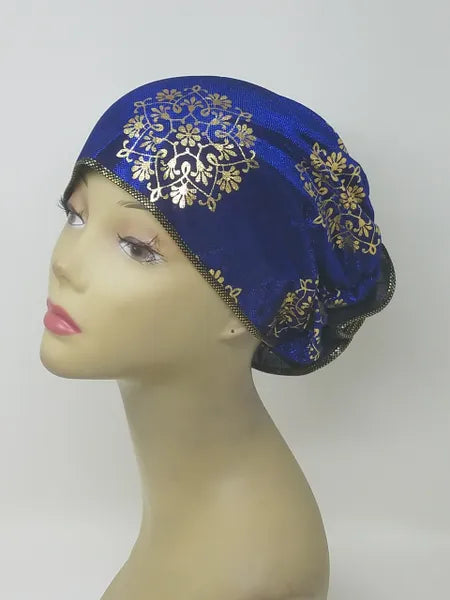 Royal blue gold patterned turban for women with shimmer detail, soft stretch fabric head covering, ready to wear turban headwear, full coverage modest headwear, lightweight breathable turban, slip on hijab alternative, elegant blue gold turban for women, comfortable daily wear head covering, stylish patterned turban