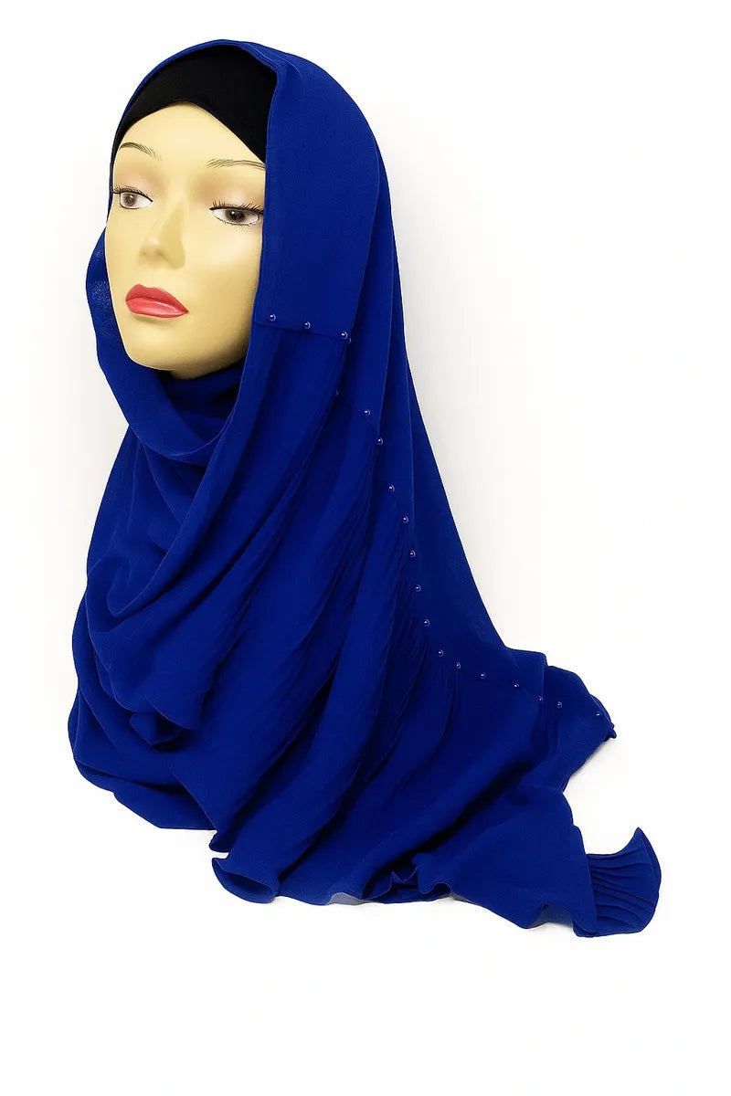 Royal blue chiffon hijab scarf made from lightweight flowing fabric, elegant modest Muslim headscarf styled on mannequin for breathable everyday hijab wear.