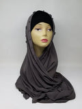 Taupe gray hijab scarf draped on mannequin, soft modest wrap with smooth drape, full coverage headscarf in neutral tone for everyday wear