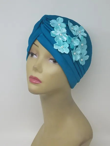 Teal floral turban for women with flower detail, soft stretch fabric head covering, ready to wear turban headwear, full coverage modest headwear, lightweight breathable turban, slip on hijab alternative, comfortable daily wear turban, stylish teal turban for women, easy wear head covering