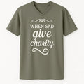Neutral Islamic t-shirt with When Sad Give Charity quote in white script lettering, Muslim inspirational shirt, modest faith apparel for Ramadan daily wear and Islamic charity reminder clothing