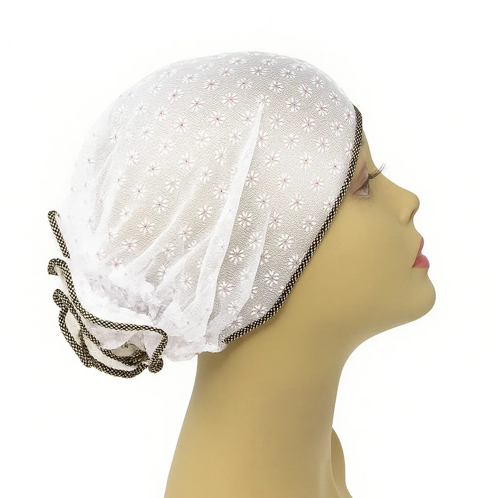 White patterned sleep bonnet cap worn on mannequin head, breathable hair protection bonnet for sleeping, modest overnight hair cover for women from Affordable Hijab USA