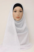 White chiffon hijab with rhinestone geometric pattern styled on mannequin, elegant full coverage modest scarf for weddings and special occasions USA