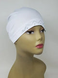 White stretch cap hijab on mannequin head, soft snug undercap, breathable fabric, comfortable everyday hijab cap, modest headwear for women
