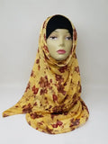 Yellow floral georgette hijab draped on mannequin, lightweight breathable scarf with red flower pattern, soft textured matte fabric, flowy elegant modest head covering for women, stylish hijab for everyday wear and special occasions