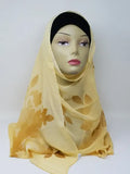 Yellow hijab scarf on mannequin, lightweight modest headscarf for women, soft flowy drape with full coverage style, bright yellow hijab for everyday wear, simple elegant wrap, breathable scarf, easy to style modest fashion accessory, front and side view