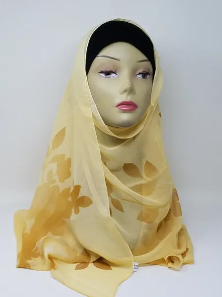 Yellow hijab scarf on mannequin, lightweight modest headscarf for women, soft flowy drape with full coverage style, bright yellow hijab for everyday wear, simple elegant wrap, breathable scarf, easy to style modest fashion accessory, front and side view