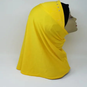 Bright yellow one piece hijab without inner cap on mannequin, soft slip on modest hijab with full coverage for everyday wear